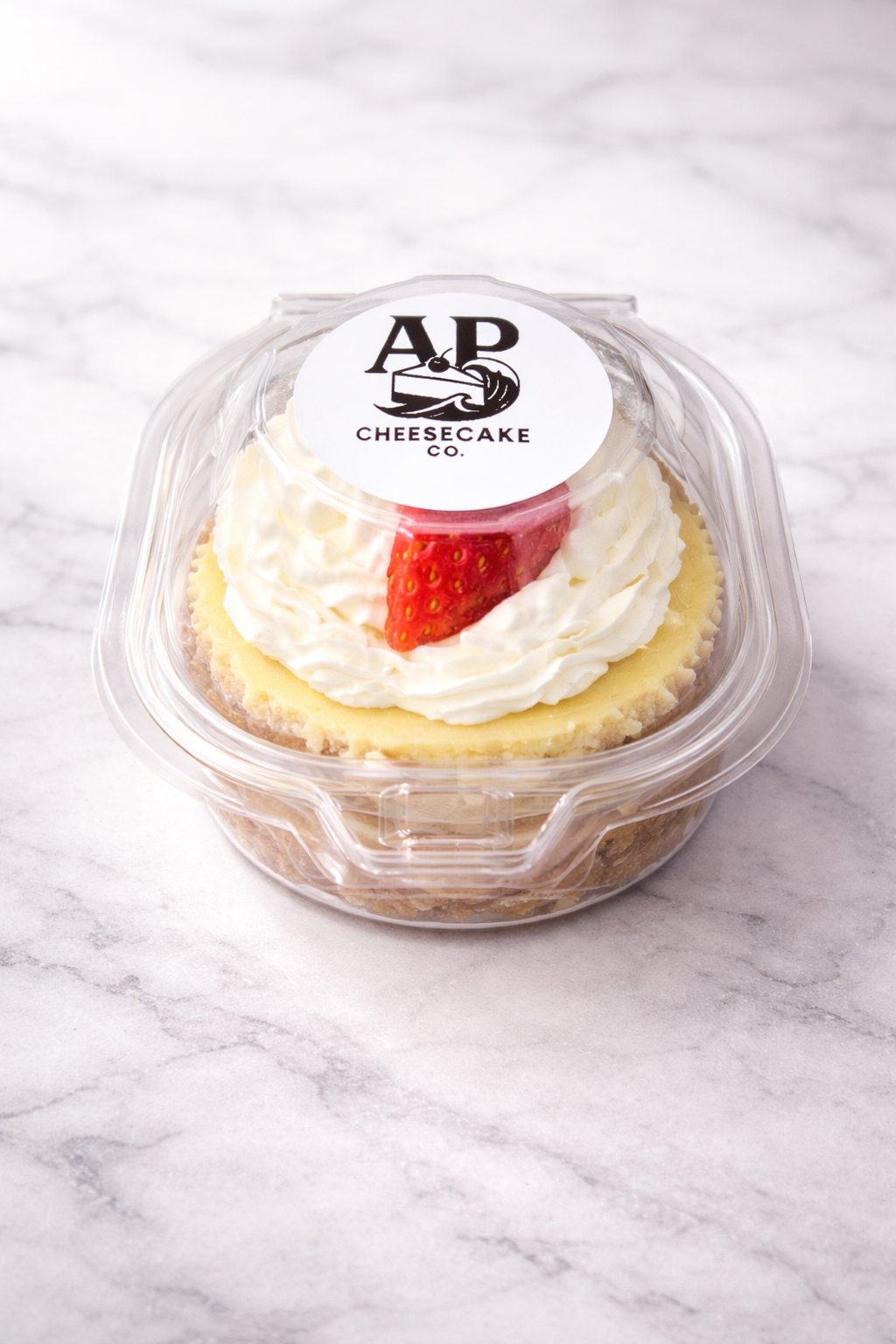 APCC cheesecake cup in branded packaging